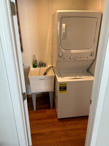 a small bathroom with a sink and a tv at Marysville Geodome Home in Marysville
