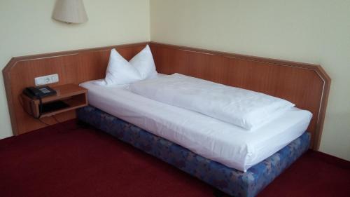 Ένα ή περισσότερα κρεβάτια σε δωμάτιο στο Hotel Berliner Ring