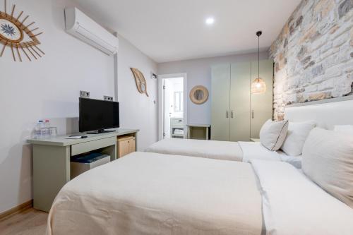 Ένα ή περισσότερα κρεβάτια σε δωμάτιο στο Hanedan Otel Foca Izmir