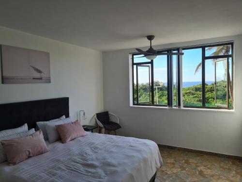 Postel nebo postele na pokoji v ubytování Capri Beach Holiday home