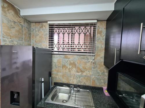 Kuchyň nebo kuchyňský kout v ubytování Capri Beach Holiday home