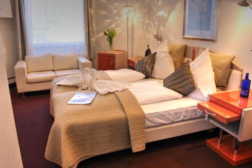 Cama o camas de una habitación en Plenus Boutique Hotel