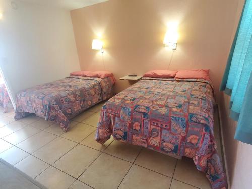 Katil atau katil-katil dalam bilik di Caprice Motel - Wildwood