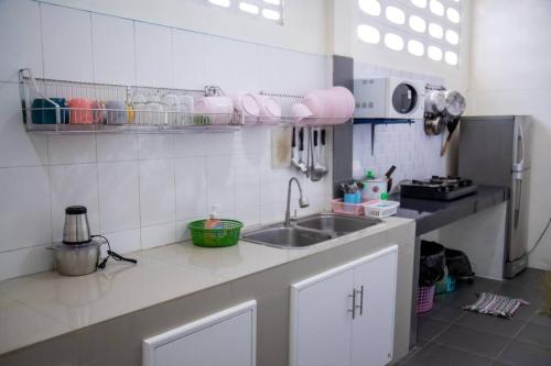 a kitchen with a sink and a counter top at Sichon Holidays in Sichon