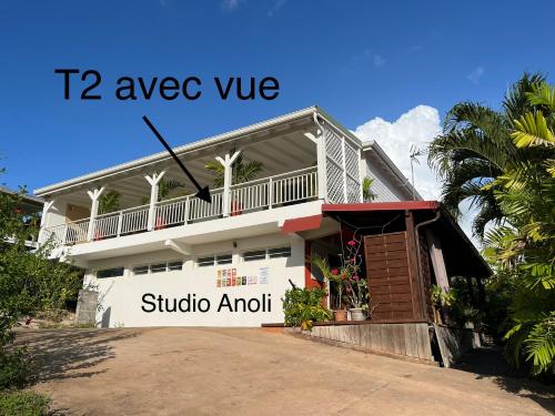 a building with a sign that reads aveva vve suggalo at Caraibe Créol' Keys in Port-Louis