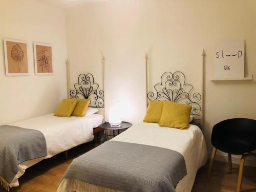 A bed or beds in a room at Nuevo Apartamento en Playa de las Canteras