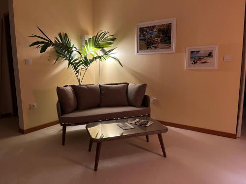 a living room with a couch and a coffee table at Caraibe Créol' Keys in Port-Louis