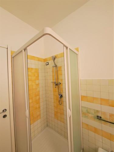 a shower with a glass door in a bathroom at Appartamento Castel Sant'Angelo in Licata