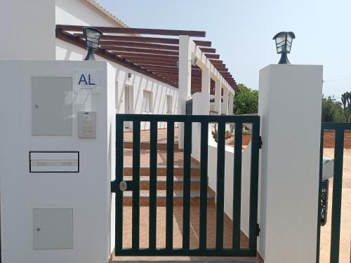 an entrance to a house with a gate at Casa Zeferino in Ferragudo