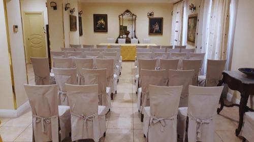 a room with rows of chairs and a altar at Hotel Akropolis - Museum Hotel in Taranto
