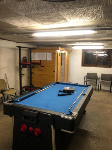 a room with a pool table in a room at Maison à sainte marie de Campan in Sainte-Marie-de-Campan