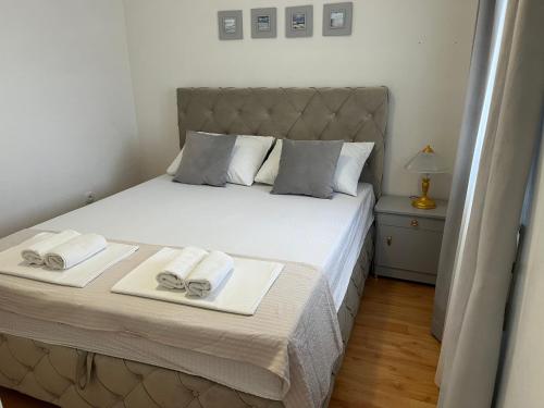 Postel nebo postele na pokoji v ubytování Apartments Medic