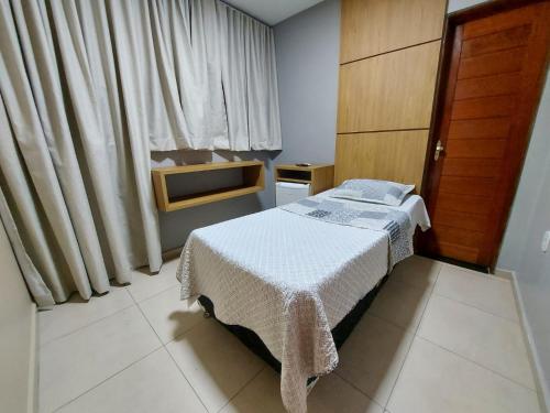 Ένα ή περισσότερα κρεβάτια σε δωμάτιο στο Hotel Pequeno Principe