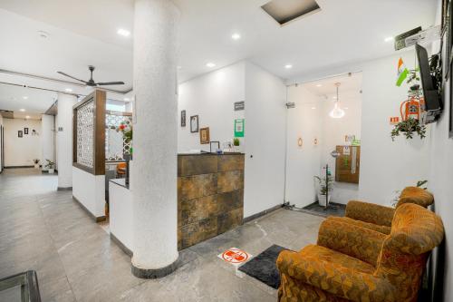 a living room with two chairs and a bar at Hotel Seven- Center of City Chandigarh in Chandīgarh