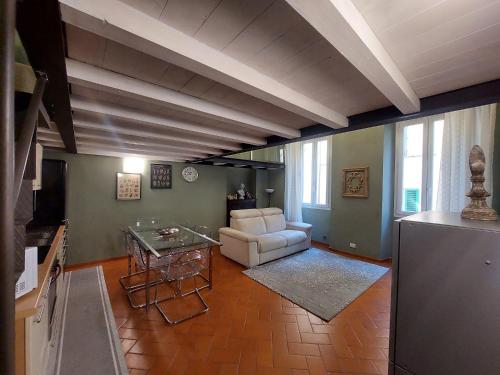 a living room with a couch and a table at Green Pepper Apartment in Florence in Florence