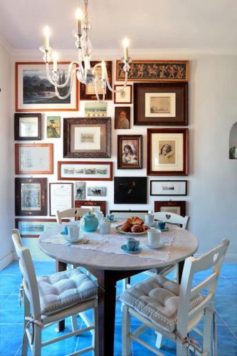a dining room with a table and chairs at Di sole e d’azzurro - sea view in Gaeta