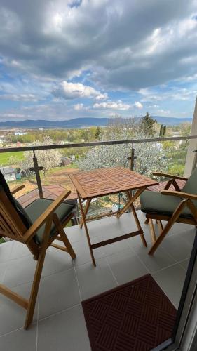 a table and chairs on a balcony with a view at Rezidencia pod Zámkom Bojnice Apartmán Luna in Bojnice
