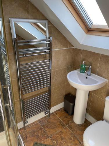 a bathroom with a sink and a shower at Spacious 10 bed house in Leicester in Leicester