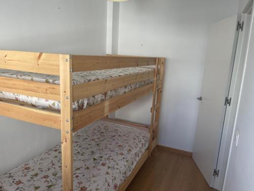 En eller flere senge i et værelse på Piso coqueto Chiclana