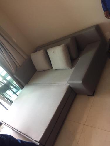 a couch with two pillows on it in a room at Salinas Exclusive Resort in Salinópolis