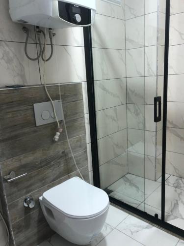 a bathroom with a toilet and a shower at seyran 3 in Trabzon