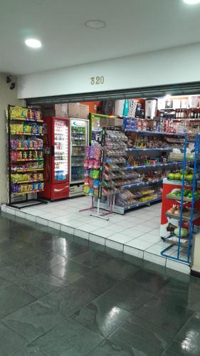 a store aisle of a grocery store with products at Loft 37 Centro histórico in Sao Paulo