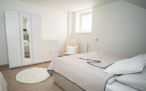 Apartmánový dům Sklípekにあるベッド