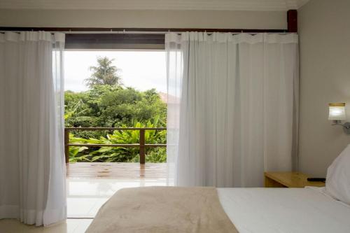Ein Bett oder Betten in einem Zimmer der Unterkunft Pousada Blue Ocean