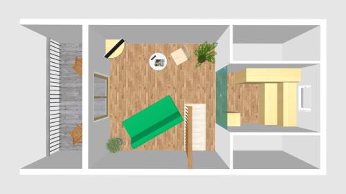 a floor plan of a house with a green flag at Wildkräuter Hexenhaus in Mauth