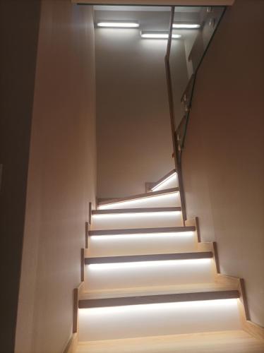 a staircase with a light at the top at Sileo Apart No.85 in Ustka