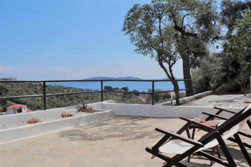 a view of the ocean from the patio of a house at Onar Houses in Achladies