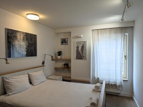 Postelja oz. postelje v sobi nastanitve Dwupoziomowy Apartament na Kazimierzu