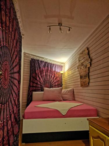 a bedroom with a bed with a red and white blanket at FREEDOM 2 in Gornji Štoj