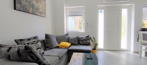 a living room with a couch and a table at Apartments Mare in Pula