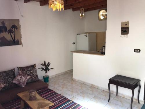 a living room with a couch and a table at Dahab house apartment 2 in Dahab