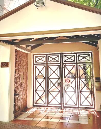a large garage door with a sign on it at Quiet luxury loft in Mendoza