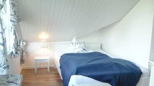 Ένα ή περισσότερα κρεβάτια σε δωμάτιο στο Gaestehaus Denecke