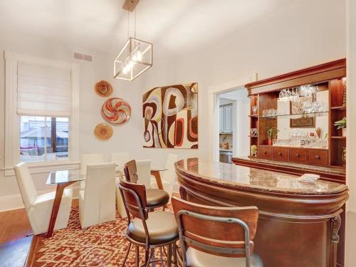 a dining room with a table and chairs at The Lyons House - Luxe Historical Home - Parking Included in Savannah