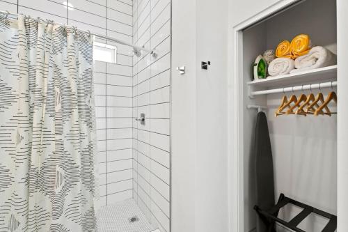 a bathroom with a shower with a shower curtain at Funky Pool Side Cabana in DTPHX in Phoenix