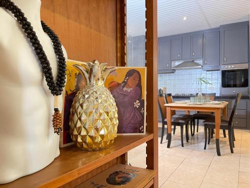 a vase on a shelf in a kitchen with a table at Lagoon & Garden House w/ kayaks in Papara