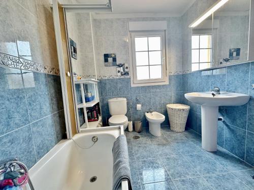 a bathroom with a tub and a sink and a toilet at Villa Ojerada - 12804 in Ajo