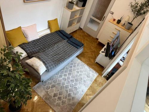 an overhead view of a living room with a couch at Awesome, 15 mins to center home in Budapest