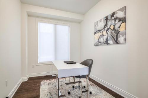 a white desk in a room with a window at Unwind Here in a Stylish and Cozy Space in Bradford
