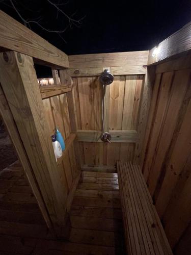 an inside view of a wooden sauna with a bench at Destin-y 30A Beach Retreat Self Checkin - Huge Private Backyard Deck with Outdoor Shower in Santa Rosa Beach
