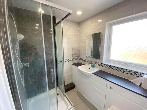 a bathroom with a shower and a sink at Three bedrooms house in Windsor in Windsor