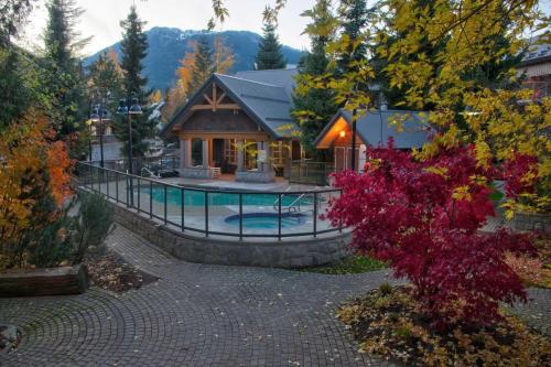 an aerial view of a house with a pool at Glaciers Reach by Allseason Vacation Rentals in Whistler
