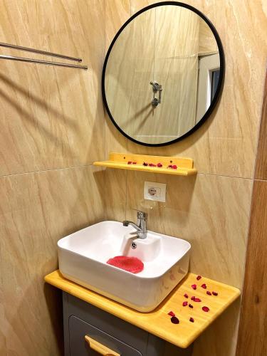 a bathroom with a sink and a mirror at HotelRestaurant Gështenja in Suharekë