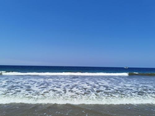 a group of waves in the ocean on a beach at Las Hamacas in Canoas De Punta Sal