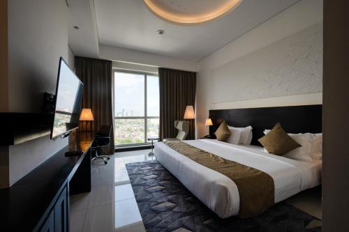 Ein Bett oder Betten in einem Zimmer der Unterkunft Orion City Hotel