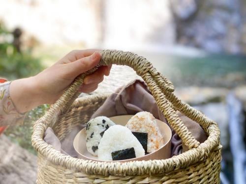 a basket filled with different types of desserts at Guesthouse KOBE YAMATOMUSUBI in Kobe